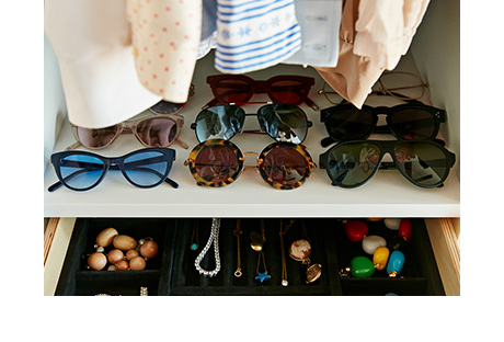 Walk in closet close up of sunglasses assortment and jewelry box created by California Closets