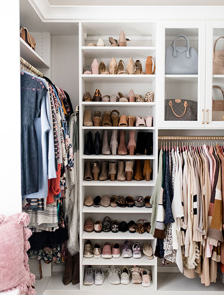 Closet with shoe shelves, hanging space and clear cabinets with doors