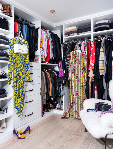 Blogger Olivia Song's custom walk in closet with built in shelving, dresser and shoe storage by California Closets