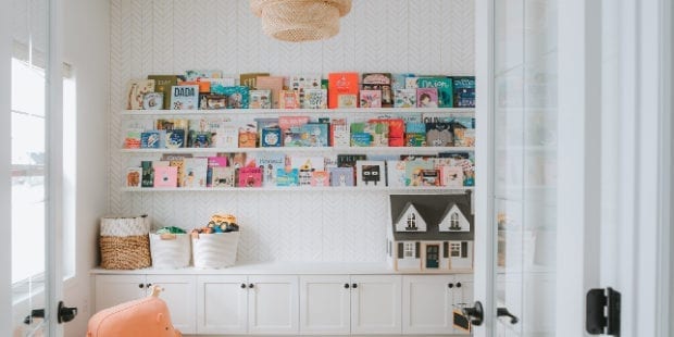 Classic white playroom with organized bookshelf for photographer Sydney Gerten