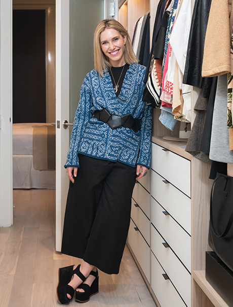 California Closets client Jamie Rosen posing happily in her new custom closet