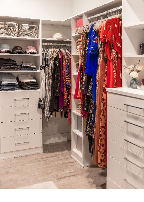 Hanging space, shelves and drawers in blogger Lindsay Surowitz's custom walk in closet