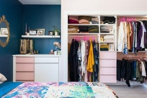 Pink and white closet in blue bedroom for Justine Ma