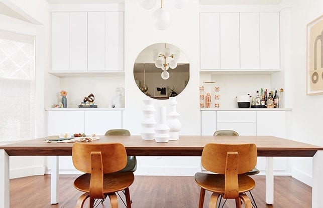 A custom dining room with white cabinetry