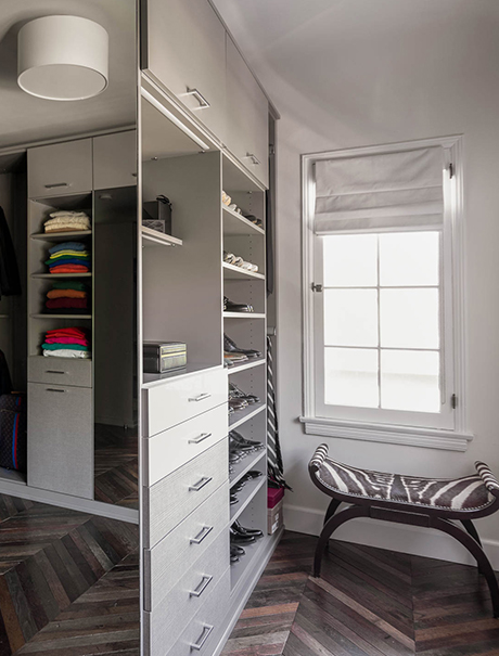 Custom shelving, cabinets, and accessory display in the mast closet for Brad Goreski