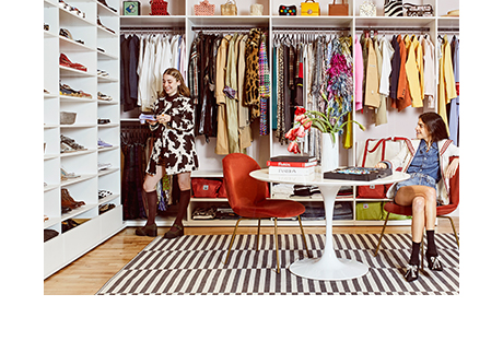 Man Repeller team in their custom walk in closet and office space created by California Closets