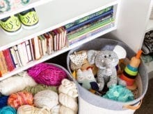 Kids book and toys on white shelf | California Closets