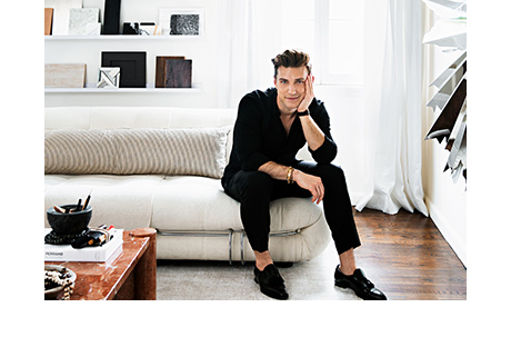 Jeremiah Brent in his updated design studio with custom shelving in white finish by California Closets