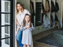 Designer Emily Current and her daughter posing in walk in closet by California Closets