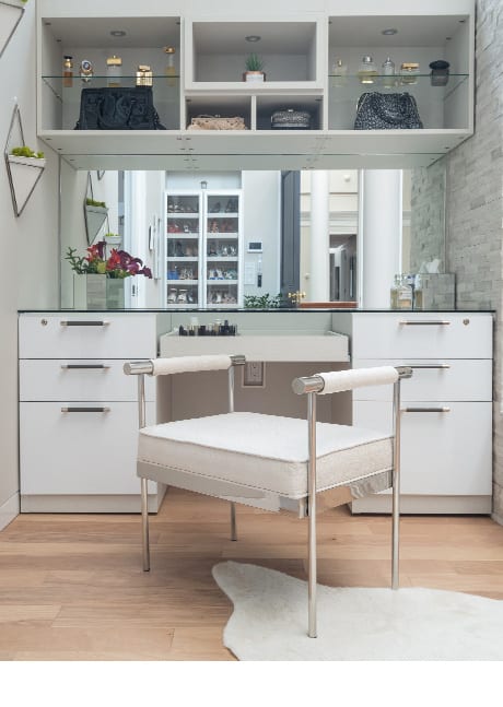 Boutique style desk and dresser area with glass countertops | California Closets