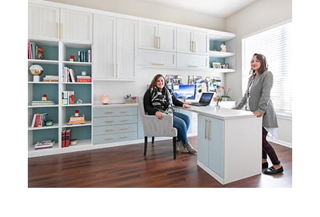 Designer Mariana Rivera and client Kadija Howes sitting in custom home office | California Closets