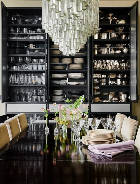 Kevin Sharkey's custom dining room shelves housing his collectables | California Closets