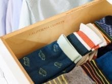Organized sock drawer in reach-in closet designed by California Closets