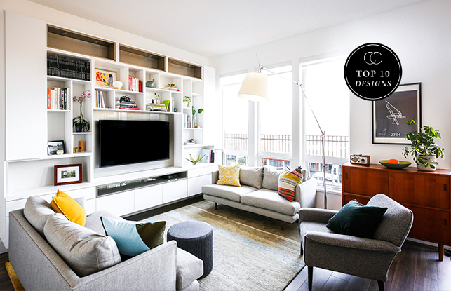 A custom media center with white finish and surrounding shelves by California Closets designer Emma Beaty