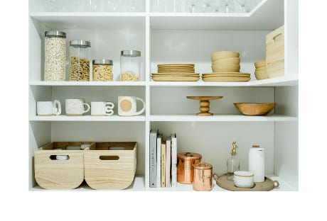 Organized white pantry shelves for interior designer Sarah Sherman Samuel
