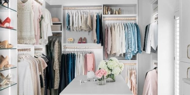 White walk in closet with light clothing for blogger Kelly Page