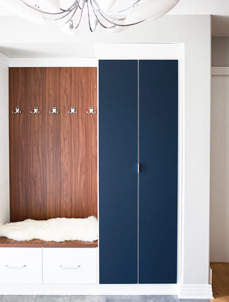 Entryway storage with blue doors closed