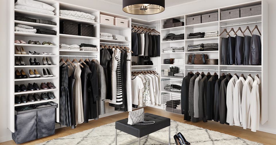 Walk in closet with hanging racks, shelving, and shoe storage