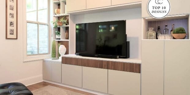 Entertainment center with tv and white cabinet doors