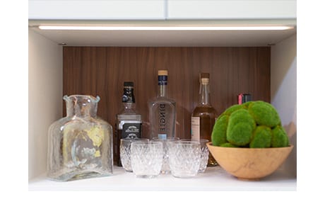 Lighted shelf with drinking glasses