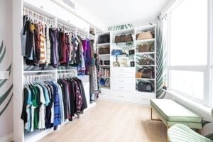 Optimized walk-in closet with hanging racks and shelves for accessories