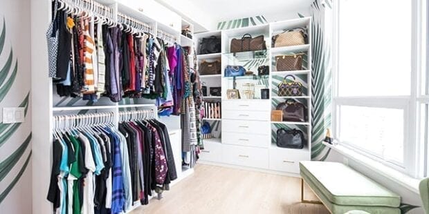 Optimized walk-in closet with hanging racks and shelves for accessories