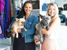 Client and designer Emma Beaty holding pug dogs