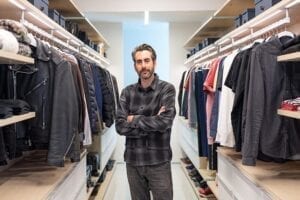 Architect Dan Brun standing in his custom walk in closet