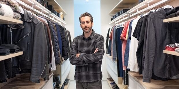 Architect Dan Brun standing in his custom walk in closet