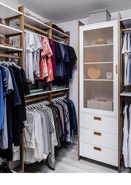 Custom walkin-in closet with multiple compartments | California Closets