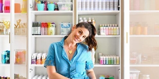 A lady in blue in front of a multiple storage closet | California Closets 