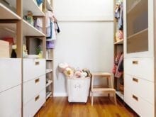 Custom walk-in closet with wood flooring | California Closets