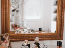 Custom cabinet with gold trim mirror | California Closets