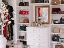 Custom walk-in closet with multiple purses | California Closets 