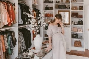 Custom walk-in closet with white flower vase | California Closets