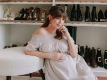 Jenny Cipoletti posing in front of custom shoe rack | California Closets