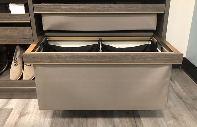 Double basket drawer holding pants shown in an Everstyle configuration in a walk in closet by California Closets