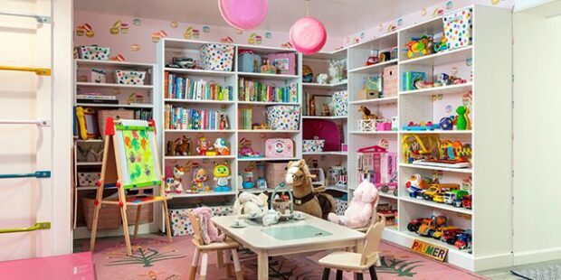 Custom pink playroom with many storage dressers | California Closets