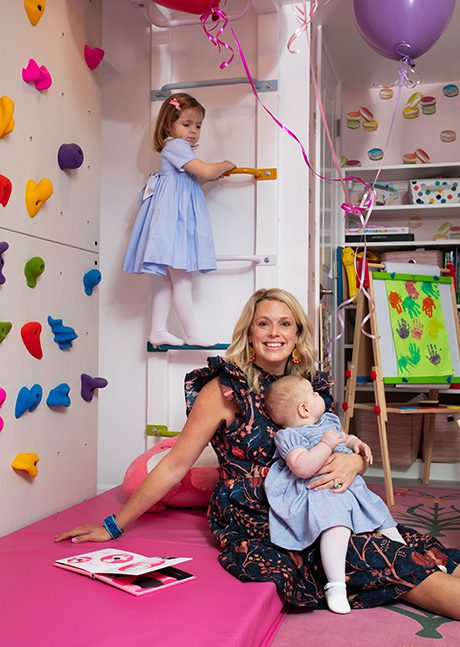 Mom and kids playing in their custom pink playroom | California Closets