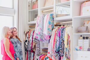 Custom closet with dresses and storage cubbies | California Closets