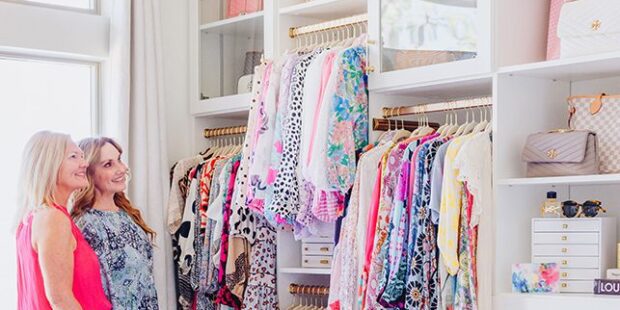 Custom closet with dresses and storage cubbies | California Closets