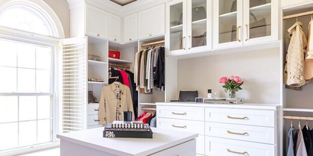 Custom white walk-in closet with center island dresser | California Closets