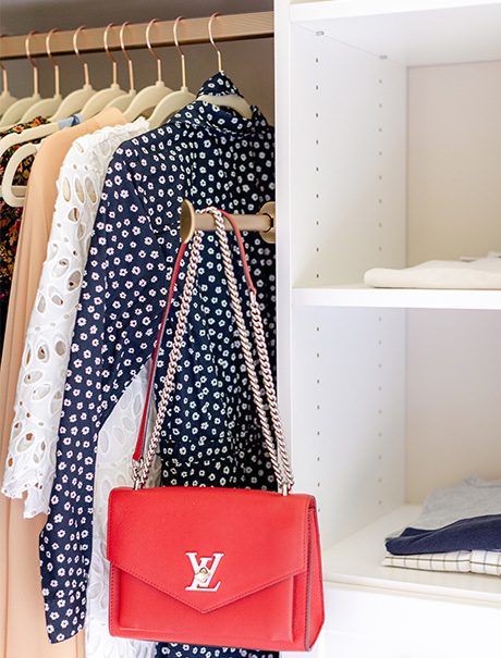 Custom closet with a red bag | California Closets