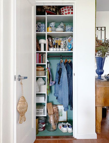 Custom closet with a blue vase | California Closets 