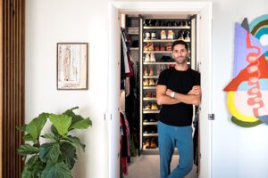 Nev Schulman standing in front of custom closet with a custom shoe rack | California Closets