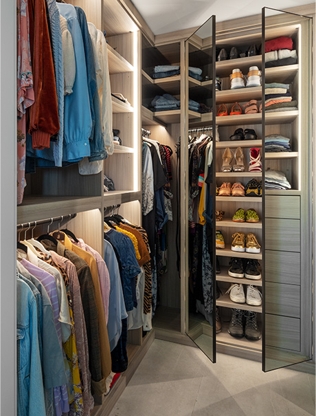 Custom closet with suits and accessories | California Closets