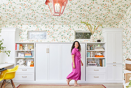 Floral walls with orange ceiling light fixture with Ariel Gordon