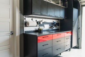 Custom garage storage showing a black tool cabinet