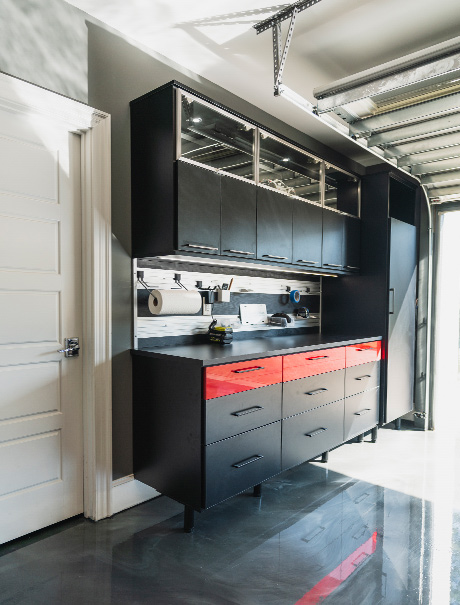 Custom black and red tool's storage cabinet in garage