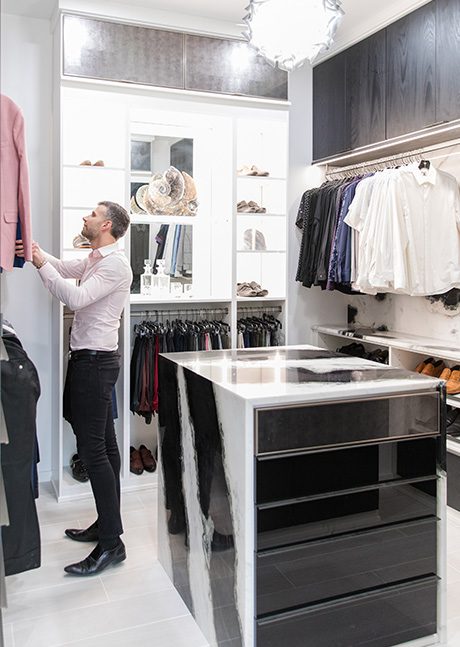Costa Kalentzos browses clothing in his custom two tone walk in closet